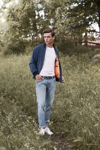 Navy and White Canvas Belt Outfits For Men: This pairing of a navy bomber jacket and a navy and white canvas belt is on the casual side yet it's also seriously stylish and truly stylish. Feeling inventive? Shake things up with a pair of white canvas low top sneakers.