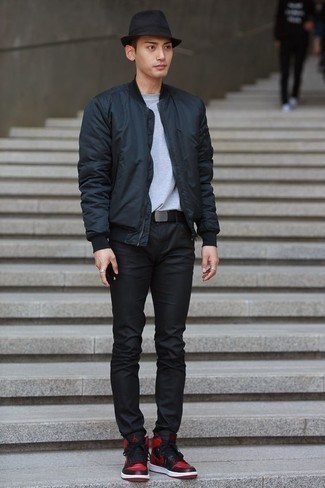 Black Bucket Hat Outfits For Men: If you're in search of a casual street style yet stylish getup, marry a black nylon bomber jacket with a black bucket hat. Feel somewhat uninspired with this look? Invite red and black leather high top sneakers to spice things up.