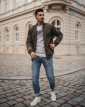 Brown Bomber Jacket Outfits For Men: Pair a brown bomber jacket with blue jeans for both dapper and easy-to-achieve look. Throw in white canvas low top sneakers and ta-da: the outfit is complete.