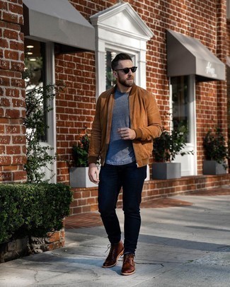 Tobacco Bomber Jacket Outfits For Men: Pair a tobacco bomber jacket with navy jeans if you seek to look casually cool without trying too hard. Brown leather casual boots will give a hint of polish to an otherwise all-too-common getup.
