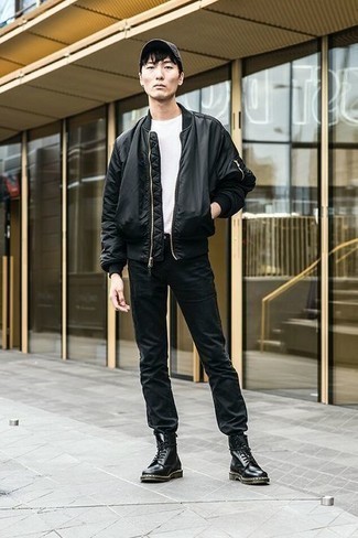 Black Bomber Jacket Outfits For Men: A black bomber jacket looks especially cool when paired with black jeans in a casual outfit. If you wish to effortlessly up the style ante of this look with footwear, why not add black leather casual boots to your getup?