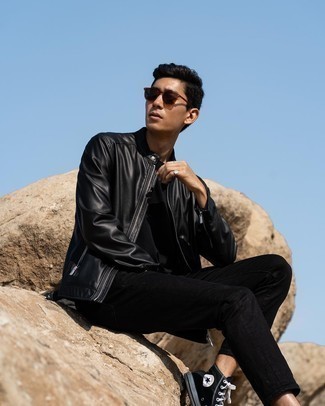 Black Leather Bomber Jacket with Black Jeans Outfits For Men: This relaxed casual pairing of a black leather bomber jacket and black jeans can go different ways according to how it's styled. Complete this getup with a pair of black canvas high top sneakers to keep the getup fresh.