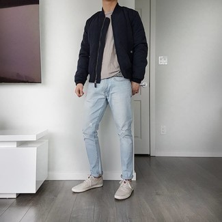 Aquamarine Jeans Outfits For Men: A navy quilted bomber jacket and aquamarine jeans are an easy way to introduce understated dapperness into your casual arsenal. Grey canvas low top sneakers work spectacularly well here.