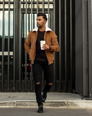 Brown Bomber Jacket Outfits For Men: Undeniable proof that a brown bomber jacket and black ripped jeans are awesome when paired together in a city casual look. Give a dose of refinement to your ensemble by sporting a pair of black leather chelsea boots.