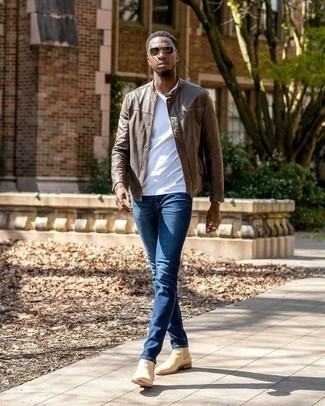 Beige Suede Chelsea Boots Outfits For Men: A dark brown leather bomber jacket and navy jeans are great menswear must-haves that will integrate nicely within your casual lineup. Got bored with this getup? Introduce a pair of beige suede chelsea boots to spice things up.