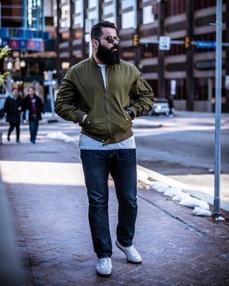 Navy Watch Outfits For Men: This relaxed combo of an olive nylon bomber jacket and a navy watch is extremely versatile and really apt for whatever's on your to-do list today. Grey suede low top sneakers will give a dash of polish to an otherwise everyday outfit.