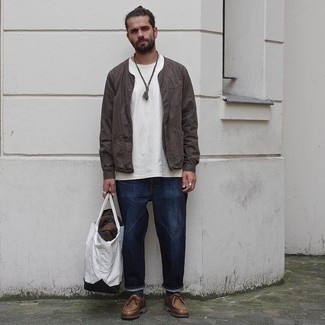 White and Black Canvas Tote Bag Outfits For Men: Try pairing a dark brown bomber jacket with a white and black canvas tote bag for a relaxed and fashionable getup. And if you want to instantly step up your look with one single piece, complete this look with a pair of brown leather desert boots.