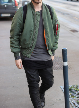Olive Bomber Jacket Outfits For Men: Opt for an olive bomber jacket and black leather jeans to feel confident and look fashionable. Finishing off with black leather high top sneakers is a guaranteed way to introduce a carefree touch to this outfit.