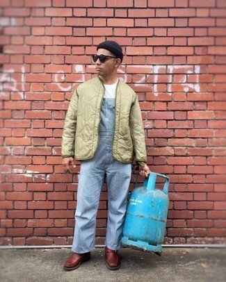 Overalls Outfits For Men: You'll be amazed at how easy it is for any gentleman to throw together a street style getup like this. Just an olive quilted bomber jacket matched with overalls. Avoid looking too casual by rounding off with brown leather chelsea boots.