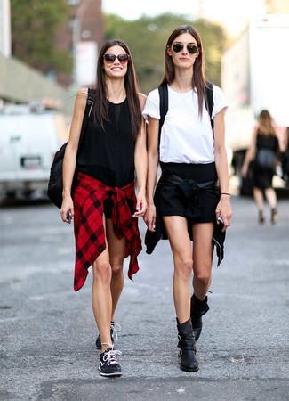 Black Shorts Outfits For Women: This pairing of a black leather bomber jacket and black shorts is hard proof that a safe casual look can still look incredibly stylish. A pair of black leather ankle boots effortlessly lifts up the ensemble.