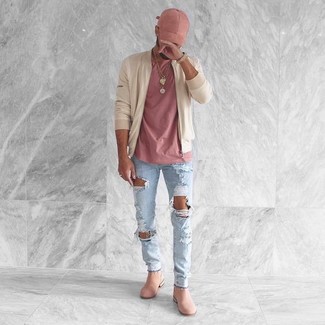 Hot Pink Crew-neck T-shirt Outfits For Men: For functionality without the need to sacrifice on fashion, we like this combo of a hot pink crew-neck t-shirt and light blue ripped skinny jeans. Add pink suede chelsea boots to the equation for an added dose of style.