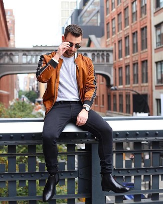 Dark Brown Bomber Jacket Outfits For Men: A dark brown bomber jacket and black skinny jeans are among those super versatile menswear staples that can completely change your wardrobe. To give your overall ensemble a more refined vibe, why not complement this outfit with black leather chelsea boots?