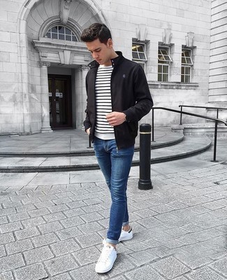 White Horizontal Striped Crew-neck T-shirt Outfits For Men: A white horizontal striped crew-neck t-shirt looks so casual and cool when worn with blue skinny jeans. Don't know how to round off your look? Rock white and black canvas low top sneakers to lift it up.