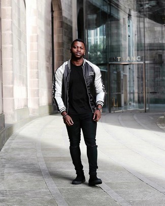 Black and White Bomber Jacket Outfits For Men: For comfort without the need to sacrifice on style, we like this combination of a black and white bomber jacket and black ripped skinny jeans. You can take a more elegant approach with shoes and complete this look with black suede chelsea boots.