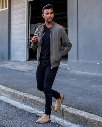 Grey Bomber Jacket Warm Weather Outfits For Men: Want to infuse your menswear collection with some laid-back cool? Consider pairing a grey bomber jacket with navy skinny jeans. Infuse a dose of sophistication into your ensemble by finishing off with tan suede chelsea boots.