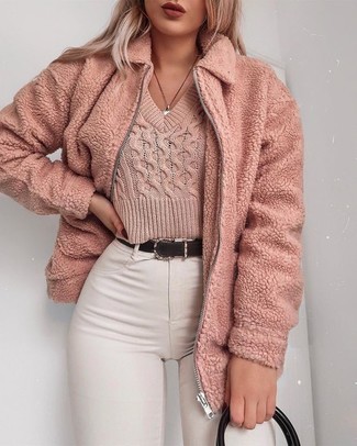 Pink Sweater Outfits For Women: Go for a simple but at the same time casually edgy look pairing a pink sweater and white skinny jeans.