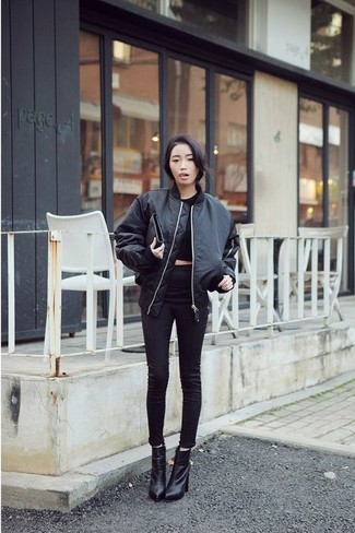 For a cool and casual getup, go for a black bomber jacket and black skinny jeans — these two items fit really well together. Avoid looking too casual by rounding off with black leather ankle boots.