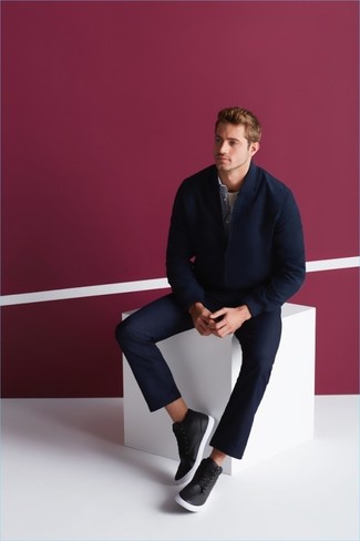 If you feel more confident in functional clothes, you'll appreciate this off-duty combination of a navy wool bomber jacket and navy chinos. Jazz up your getup by finishing with black leather high top sneakers.