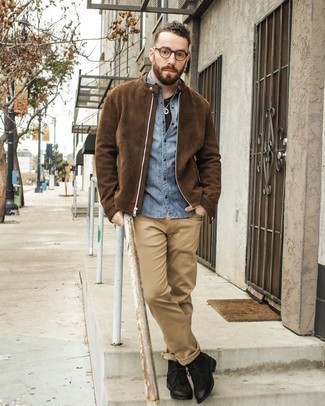 Brown Crew-neck T-shirt Outfits For Men: On days when comfort is essential, this combination of a brown crew-neck t-shirt and khaki jeans is always a winner. If you wish to easily up your getup with one single piece, why not complete your outfit with a pair of black suede desert boots?