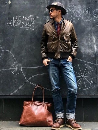 Brown Bomber Jacket Outfits For Men: For something more on the cool and laid-back side, try this pairing of a brown bomber jacket and blue jeans. If you wish to instantly perk up this look with a pair of shoes, why not complete this ensemble with a pair of burgundy leather casual boots?