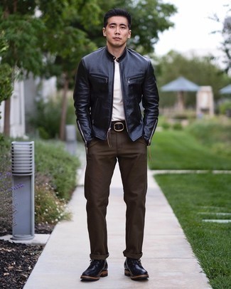 Black Leather Bomber Jacket Outfits For Men: If you love classic pairings, then you'll love this combination of a black leather bomber jacket and dark brown chinos. A pair of black leather casual boots instantly polishes up the ensemble.