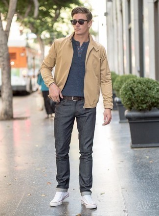 Tan Bomber Jacket Outfits For Men: Wear a tan bomber jacket and charcoal jeans to assemble an interesting and modern-looking casual ensemble. When in doubt as to the footwear, complete your ensemble with white canvas low top sneakers.