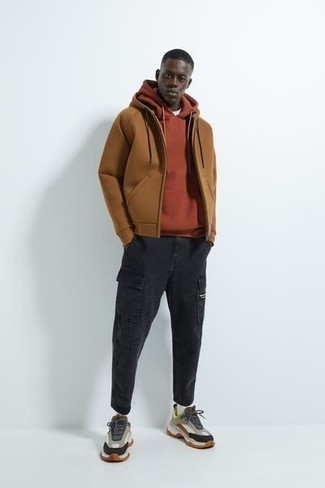 Orange Hoodie Outfits For Men: To create a casual ensemble with an urban spin, go for an orange hoodie and black cargo pants. And if you want to easily tone down this ensemble with one single piece, throw a pair of brown athletic shoes in the mix.