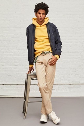 Bomber Jacket Outfits For Men: Why not reach for a bomber jacket and khaki chinos? As well as totally practical, these pieces look great together. Don't know how to finish? Introduce beige canvas high top sneakers to the mix to spice things up.
