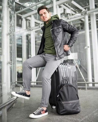 Black Suitcase Outfits For Men: You'll be amazed at how extremely easy it is for any man to pull together a city casual look like this. Just a black leather bomber jacket and a black suitcase. Take your ensemble down a whole other path by sporting black print canvas low top sneakers.