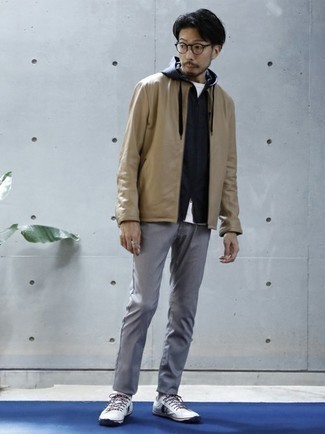 Tan Bomber Jacket Outfits For Men: Team a tan bomber jacket with grey chinos for relaxed dressing with a twist. Take a more laid-back approach with footwear and introduce white and navy canvas low top sneakers to the equation.