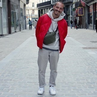 White Leather Low Top Sneakers Outfits For Men: A red quilted bomber jacket and grey jeans are the kind of a never-failing casual look that you need when you have no extra time to dress up. We're loving how cohesive this outfit looks when rounded off by a pair of white leather low top sneakers.