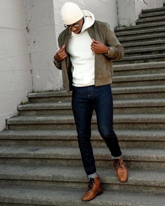 Olive Suede Bomber Jacket Outfits For Men: This pairing of an olive suede bomber jacket and navy jeans is impeccably stylish and yet it's casual enough and apt for anything. If you wish to instantly rev up your outfit with a pair of shoes, introduce a pair of brown leather casual boots to this ensemble.