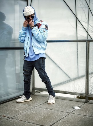 Light Blue Embroidered Bomber Jacket Outfits For Men: To create a casual ensemble with an urban take, you can opt for a light blue embroidered bomber jacket and charcoal ripped jeans. Go off the beaten track and shake up your outfit by finishing with a pair of white athletic shoes.