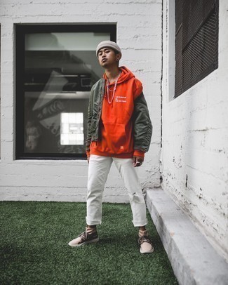 Orange Hoodie Outfits For Men: Consider wearing an orange hoodie and white ripped jeans for a relaxed look with an urban spin. Complete your look with beige athletic shoes and off you go looking incredible.