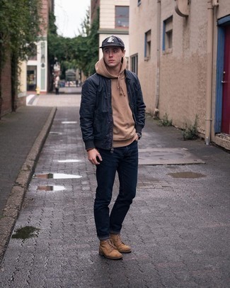 Tan Hoodie Outfits For Men: Make a tan hoodie and navy jeans your outfit choice to feel absolutely confident and look cool and casual. Rev up the classiness of your look a bit by slipping into a pair of brown suede casual boots.