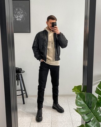 Black Jeans Outfits For Men: This combination of a black bomber jacket and black jeans is on the casual side yet it's also dapper and truly stylish. Want to tone it down on the shoe front? Complete your look with a pair of black leather work boots for the day.