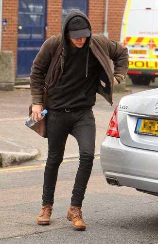 Harry Styles wearing Brown Bomber Jacket, Black Hoodie, Black Skinny Jeans, Tan Leather Casual Boots