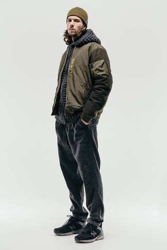 Olive Bomber Jacket Outfits For Men: This pairing of an olive bomber jacket and charcoal sweatpants is proof that a pared down casual outfit doesn't have to be boring. To infuse a hint of stylish casualness into this ensemble, add a pair of black athletic shoes to this outfit.