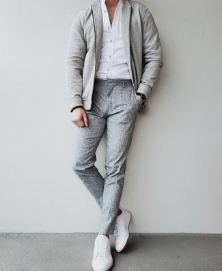 Grey Bomber Jacket Warm Weather Outfits For Men: A grey bomber jacket and grey chinos are a go-to pairing for many stylish gentlemen. If you need to immediately dress down this outfit with footwear, complement your look with white leather low top sneakers.