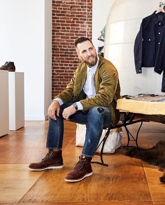 Navy Ripped Jeans Outfits For Men: A brown quilted bomber jacket and navy ripped jeans are an urban combo that every trendsetting man should have in his off-duty rotation. Finishing off with brown leather casual boots is a surefire way to add a bit of fanciness to your getup.