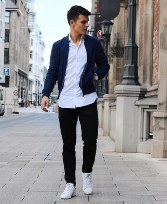 Men's Navy Bomber Jacket, White Long Sleeve Shirt, Black Jeans, White and Green Leather Low Top Sneakers
