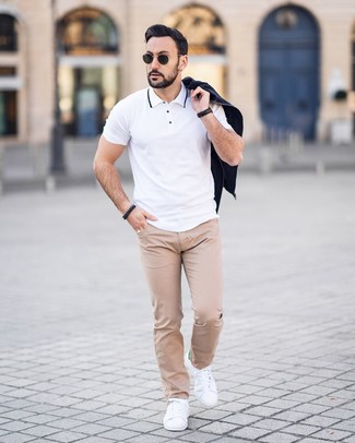 Beige Polka Dot Chinos Outfits: A black bomber jacket and beige polka dot chinos teamed together are a smart match. If you don't know how to finish, add white leather low top sneakers to this ensemble.