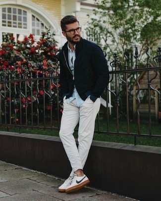 Men's Navy Suede Bomber Jacket, Light Blue Chambray Short Sleeve Shirt, White Chinos, White and Navy Leather Low Top Sneakers