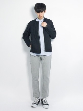 Black Bomber Jacket Outfits For Men: Why not consider wearing a black bomber jacket and grey chinos? These pieces are very comfortable and look amazing when paired together. For something more on the daring side to finish your getup, add a pair of black and white canvas low top sneakers to the equation.