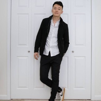 Black Chinos Outfits: A black suede bomber jacket and black chinos will give off this neat and relaxed vibe. A pair of white and navy leather low top sneakers can instantly tone down an all-too-dressy outfit.