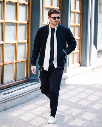 Navy Bomber Jacket Outfits For Men: This combo of a navy bomber jacket and navy chinos is hard proof that a safe casual look doesn't have to be boring. Complement your outfit with a pair of white canvas slip-on sneakers and ta-da: this outfit is complete.