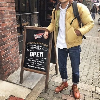 Black Canvas Backpack Outfits For Men: Such staples as a beige quilted bomber jacket and a black canvas backpack are the perfect way to introduce toned down dapperness into your current casual fashion mix. Up the dressiness of this outfit a bit by finishing off with brown leather casual boots.