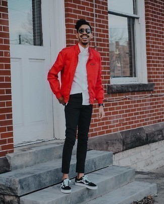 Black Leather Watch Outfits For Men: We all look for practicality when it comes to styling, and this casual street style combination of a red bomber jacket and a black leather watch is an amazing example of that. Complete your look with black and white canvas low top sneakers to completely shake up the ensemble.