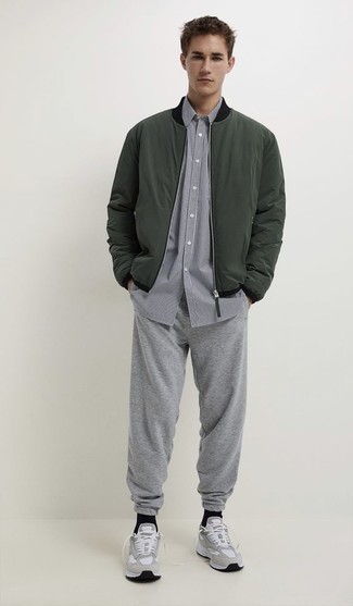 Men's Dark Green Bomber Jacket, Grey Vertical Striped Short Sleeve Shirt, Grey Sweatpants, Grey Athletic Shoes
