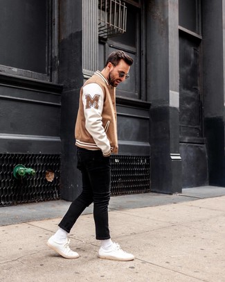 White and Blue Bomber Jacket Outfits For Men: For a cool and relaxed outfit, wear a white and blue bomber jacket and black skinny jeans — these two pieces work beautifully together. A pair of white leather low top sneakers rounds off this ensemble quite well.